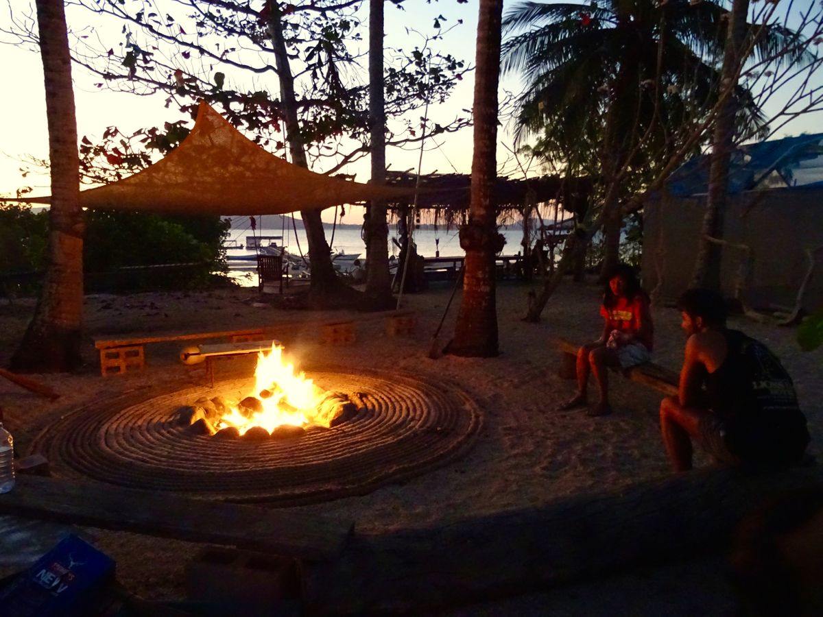 Roko Island Sitting Around Campfire - Explore Cape York